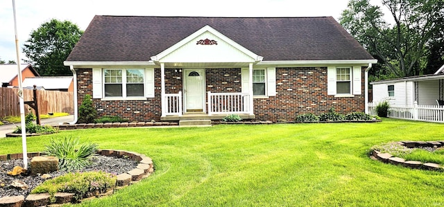 318 W Jefferson St, Chandler, IN 47610 - view of front of property with brick siding and roof with shingles