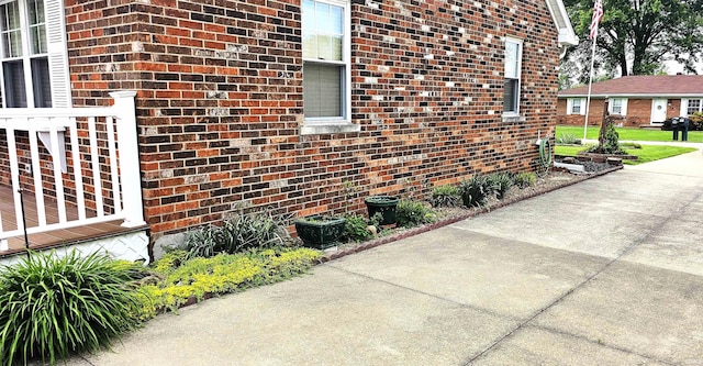 318 W Jefferson St, Chandler, IN 47610 - view of home's exterior featuring brick siding