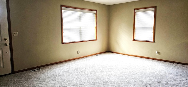 318 W Jefferson St, Chandler, IN 47610 - unfurnished room with carpet floors, plenty of natural light, and baseboards