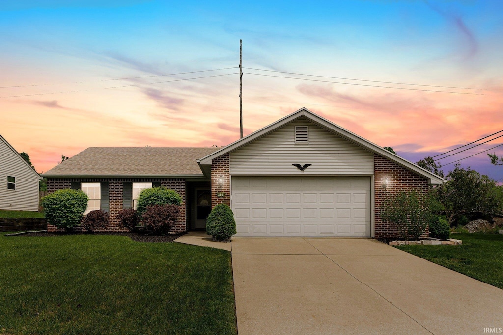 3104 Cedar Ridge Run, Fort Wayne, IN 46808 - view of front facade featuring brick siding, an attached garage, concrete driveway, and a front lawn