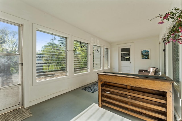sunroom / solarium with finished concrete flooring