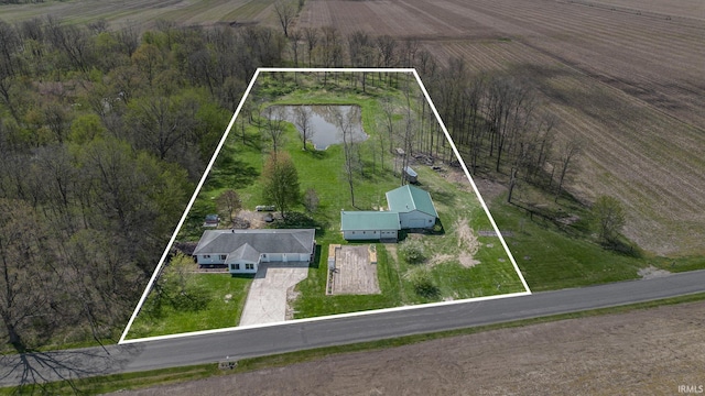 aerial view of sparsely populated area featuring property boundaries highlighted and a nearby body of water