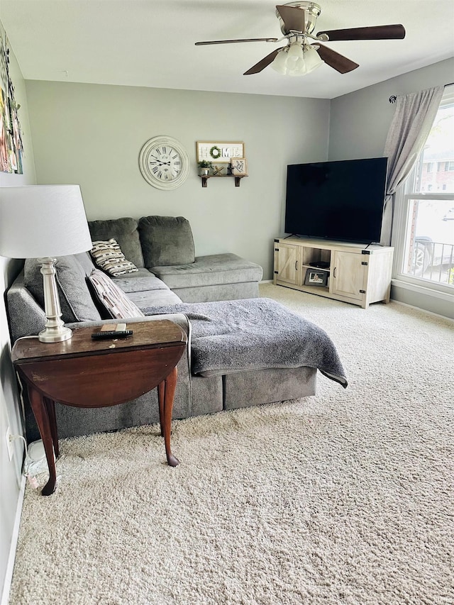 2912 W Twickingham Dr, Muncie, IN 47304 - living area featuring carpet, a ceiling fan, and baseboards