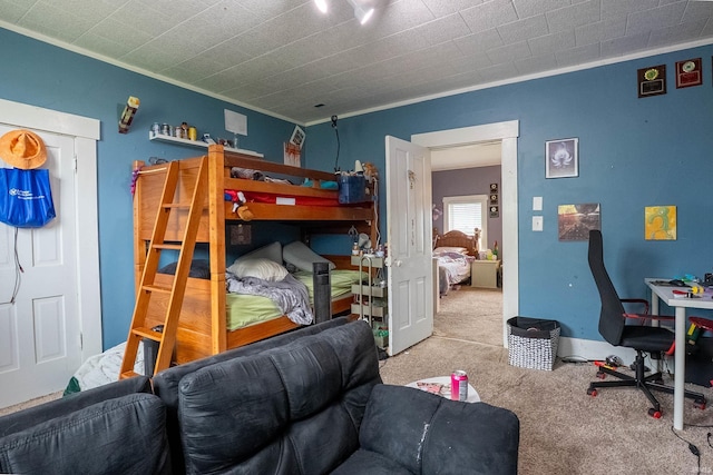 carpeted bedroom featuring crown molding