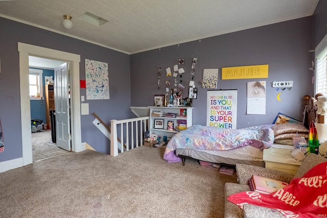 bedroom with carpet floors and ornamental molding