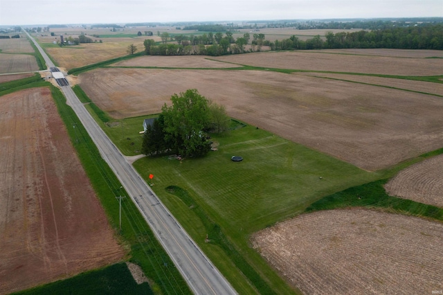 aerial view of property and surrounding area featuring rural landscape