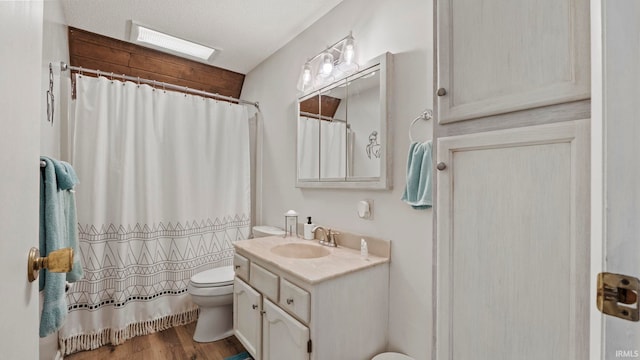 11381 NE Wawasee Dr, Syracuse, IN 46567 - bathroom featuring toilet, wood finished floors, vanity, and a shower with shower curtain