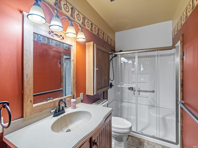 422 E Washingtion St, Oakland City, IN 47660 - full bathroom with a stall shower, toilet, vanity, and tile patterned floors