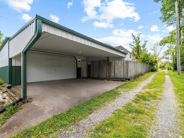 422 E Washingtion St, Oakland City, IN 47660 - garage featuring driveway and fence