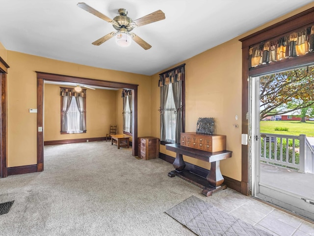 422 E Washingtion St, Oakland City, IN 47660 - entryway featuring plenty of natural light, ceiling fan, baseboards, and carpet