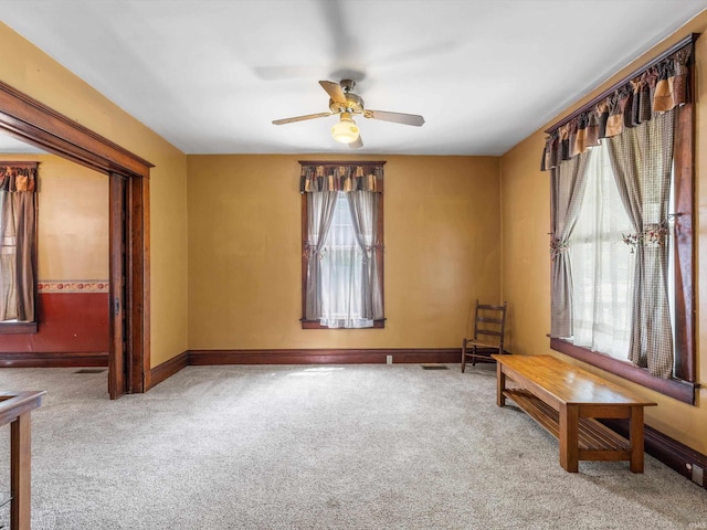 422 E Washingtion St, Oakland City, IN 47660 - unfurnished room featuring carpet flooring, a ceiling fan, and baseboards