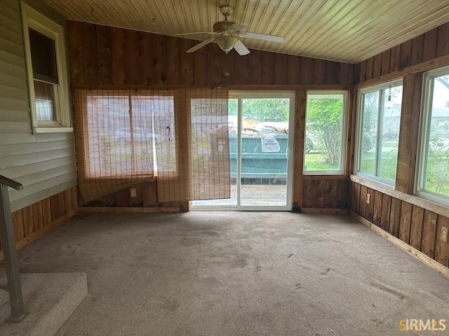 128 S Main St, Griffin, IN 47616 - unfurnished sunroom with wooden walls, vaulted ceiling, and carpet floors