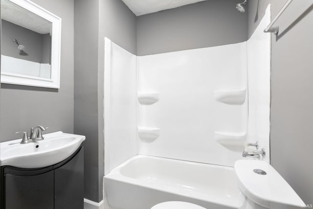 bathroom featuring shower / tub combination, toilet, and vanity