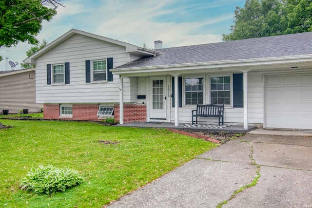 1818 Chochtimar Trl, Fort Wayne, IN 46808 - tri-level home with a porch, a garage, a front lawn, driveway, and roof with shingles