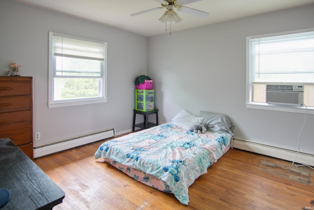 1818 Chochtimar Trl, Fort Wayne, IN 46808 - bedroom with a baseboard radiator, multiple windows, wood finished floors, and cooling unit