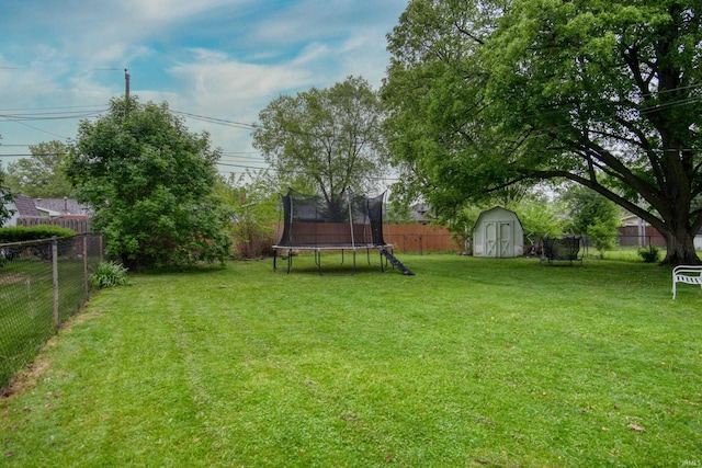1818 Chochtimar Trl, Fort Wayne, IN 46808 - view of yard with a trampoline, a storage unit, and an outbuilding