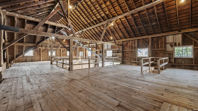 unfinished attic with an upstairs landing