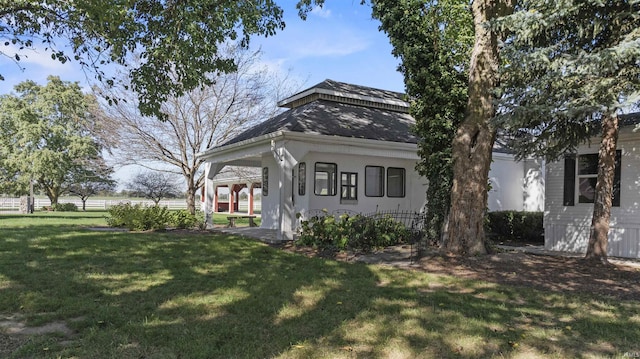 view of front of home with a shingled roof