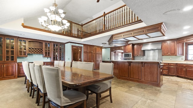 dining area with recessed lighting, high vaulted ceiling, and a chandelier