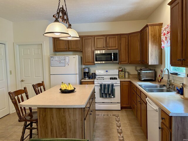 1804 Canyon Creek Dr, Lafayette, IN 47909 - kitchen with white appliances, a sink, light tile patterned flooring, a breakfast bar, and light countertops