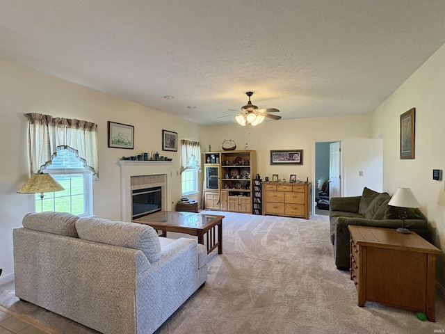 1804 Canyon Creek Dr, Lafayette, IN 47909 - living area featuring plenty of natural light, a glass covered fireplace, carpet flooring, and a ceiling fan