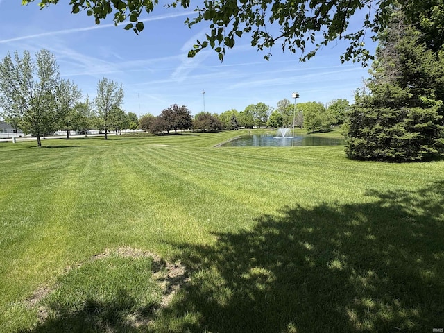 1804 Canyon Creek Dr, Lafayette, IN 47909 - view of property's community with a water view and a lawn