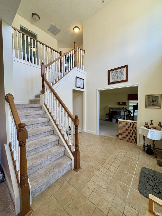 1804 Canyon Creek Dr, Lafayette, IN 47909 - stairs featuring a towering ceiling and baseboards