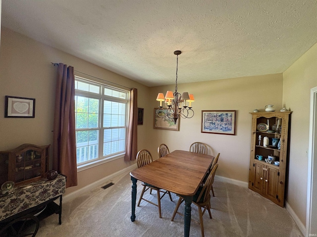 1804 Canyon Creek Dr, Lafayette, IN 47909 - carpeted dining space with a chandelier, a textured ceiling, and baseboards