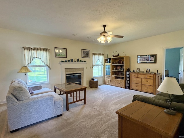 1804 Canyon Creek Dr, Lafayette, IN 47909 - living room featuring plenty of natural light, a ceiling fan, a tile fireplace, and light carpet