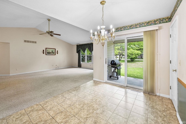 carpeted spare room with a chandelier, ceiling fan, lofted ceiling, baseboards, and tile patterned floors