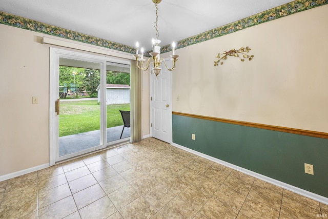 unfurnished room featuring a chandelier, baseboards, and tile patterned floors