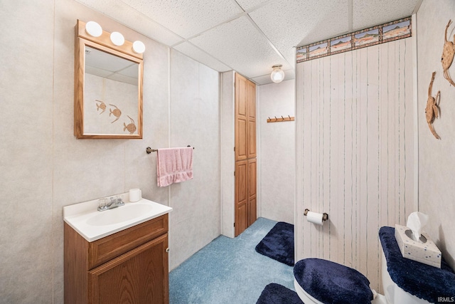 bathroom with vanity and a drop ceiling