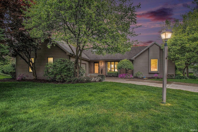 16166 Candlewycke Ct, Granger, IN 46530 - view of front of property featuring a garage, concrete driveway, and a lawn