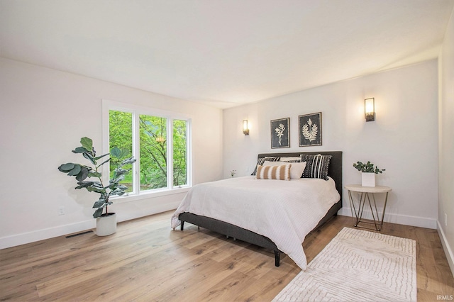 16166 Candlewycke Ct, Granger, IN 46530 - bedroom with baseboards and light wood-style flooring