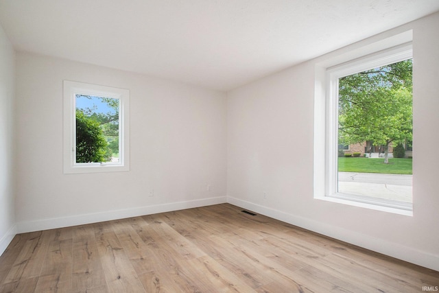 16166 Candlewycke Ct, Granger, IN 46530 - unfurnished room featuring healthy amount of natural light, light wood-type flooring, and baseboards