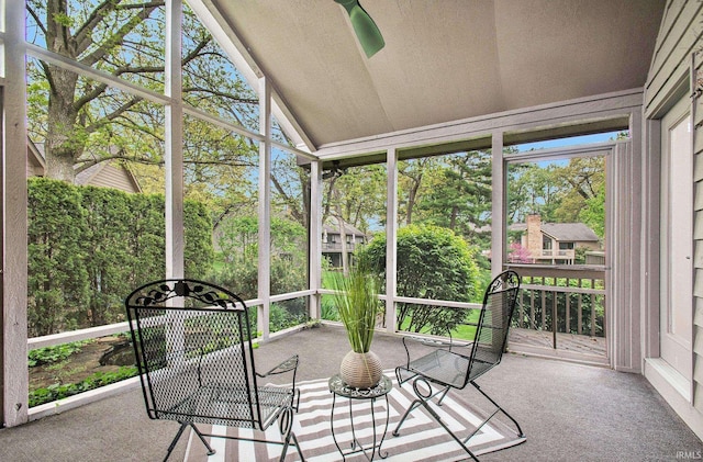 16166 Candlewycke Ct, Granger, IN 46530 - unfurnished sunroom featuring lofted ceiling, view of scattered trees, and plenty of natural light
