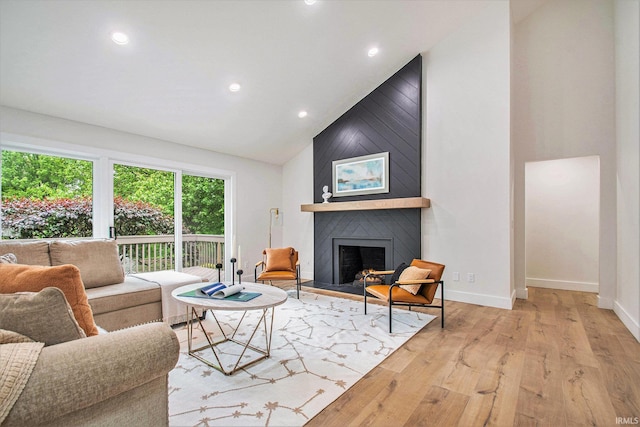16166 Candlewycke Ct, Granger, IN 46530 - living area featuring high vaulted ceiling, a fireplace, wood finished floors, recessed lighting, and baseboards