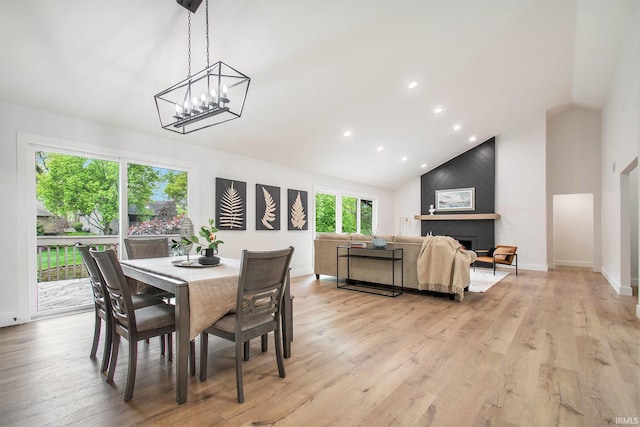 16166 Candlewycke Ct, Granger, IN 46530 - dining room with high vaulted ceiling, light wood finished floors, recessed lighting, a chandelier, and baseboards