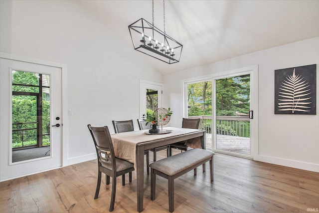 16166 Candlewycke Ct, Granger, IN 46530 - dining room featuring plenty of natural light, light wood-type flooring, baseboards, and high vaulted ceiling
