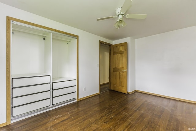 11009 S County Road 300 W, Muncie, IN 47302 - unfurnished bedroom with dark wood-style flooring, baseboards, a closet, and a ceiling fan
