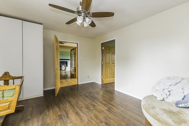11009 S County Road 300 W, Muncie, IN 47302 - sitting room featuring a ceiling fan, wood finished floors, and baseboards