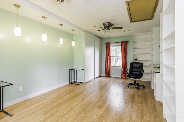11009 S County Road 300 W, Muncie, IN 47302 - unfurnished office with attic access, wood finished floors, ceiling fan, a textured ceiling, and baseboards
