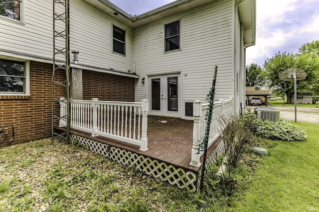11009 S County Road 300 W, Muncie, IN 47302 - back of house featuring a wooden deck, brick siding, french doors, and central AC