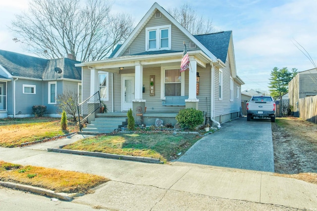 1409 Main St, Vincennes, IN 47591 - bungalow with covered porch, driveway, and fence