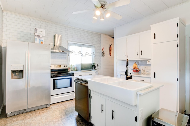 1409 Main St, Vincennes, IN 47591 - kitchen with appliances with stainless steel finishes, wall chimney exhaust hood, tasteful backsplash, and a ceiling fan