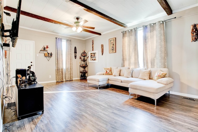 1409 Main St, Vincennes, IN 47591 - living area featuring beamed ceiling, wood finished floors, a ceiling fan, baseboards, and ornamental molding