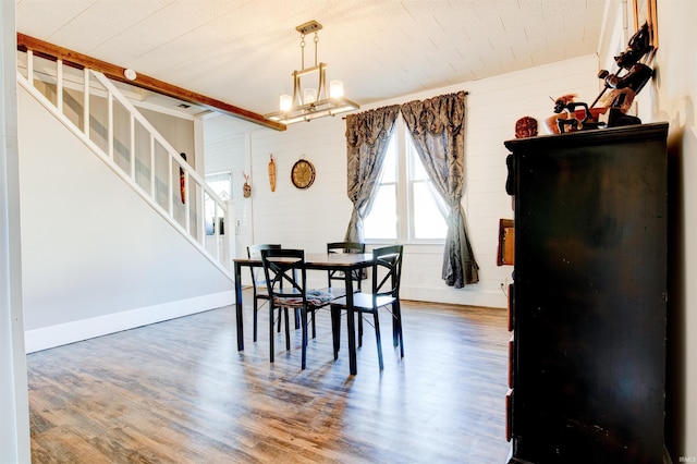 1409 Main St, Vincennes, IN 47591 - dining room with wood finished floors, stairs, and a chandelier