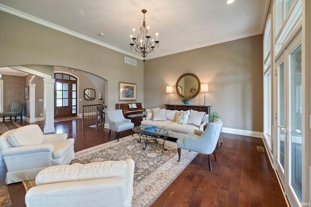 5198 Gardenia Ct, West Lafayette, IN 47906 - living area with arched walkways, decorative columns, a chandelier, baseboards, and wood finished floors