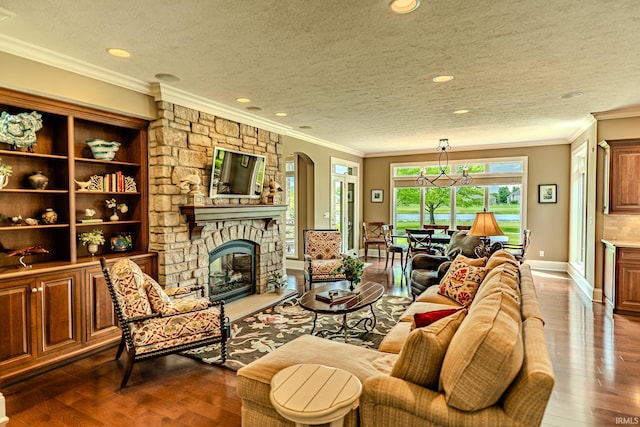 5198 Gardenia Ct, West Lafayette, IN 47906 - living area featuring a stone fireplace, dark wood-type flooring, arched walkways, a textured ceiling, and crown molding