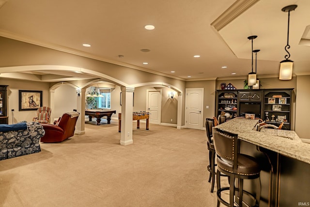 5198 Gardenia Ct, West Lafayette, IN 47906 - interior space with arched walkways, ornate columns, light carpet, light stone counters, and crown molding